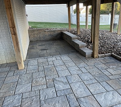 Retaining wall under a deck to accomodate a storage shed